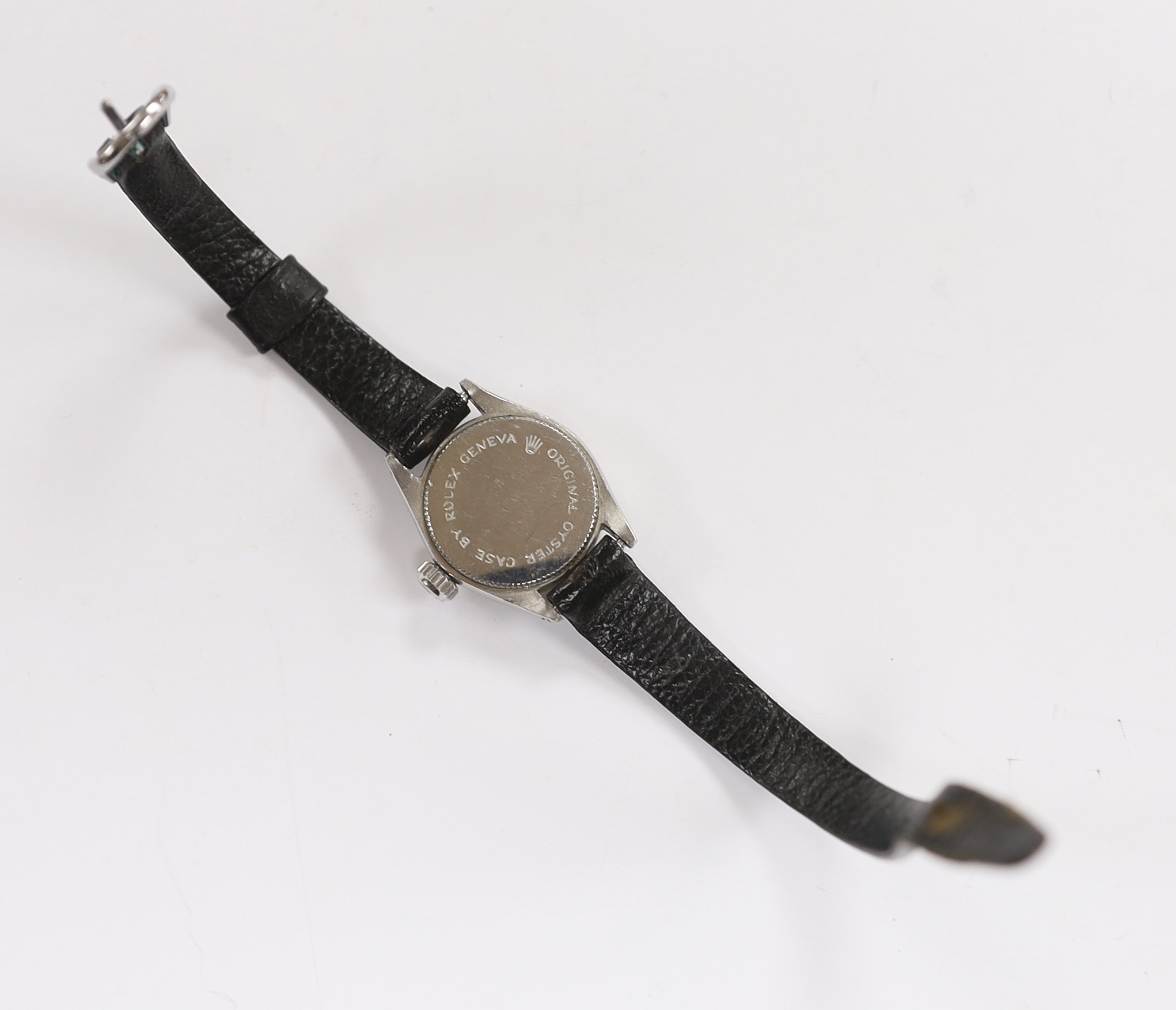 A lady's stainless steel Tudor Oyster Royal manual wind wrist watch, on an associated black leather strap, with Tudor box and receipt.